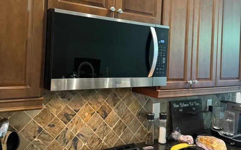 Over-the-range microwave installed above a gas range